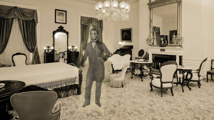 A sepia photograph of the Lincoln Bedroom, with a facsimile of Lincoln's ghost in the centre.