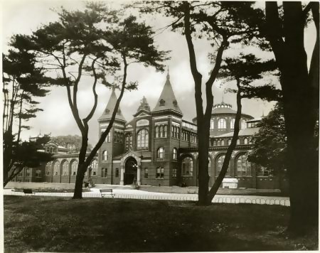 A black and white photo of the Gothic spires of the Smithsonian Castle, designed by architect James Renwick, Jr